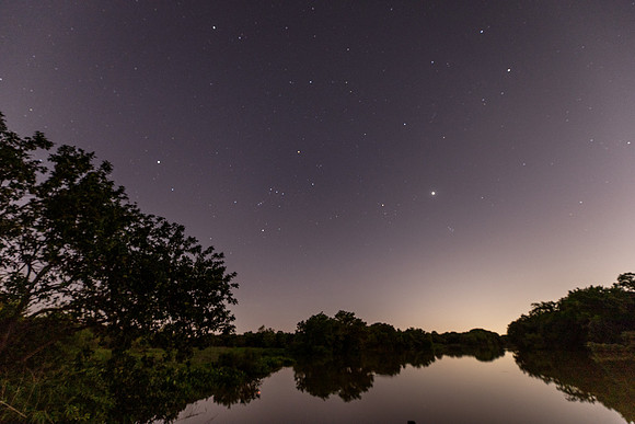 A 'B' for effort night shot over the river with the Houston city lights on the horizon.
